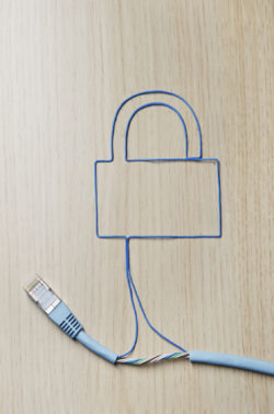 Network security. Blue ethernet cable shaping a padlock